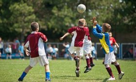 children playing football